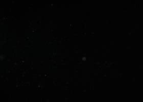 Creative abstract image of particles on a black background resembling a starry night sky.